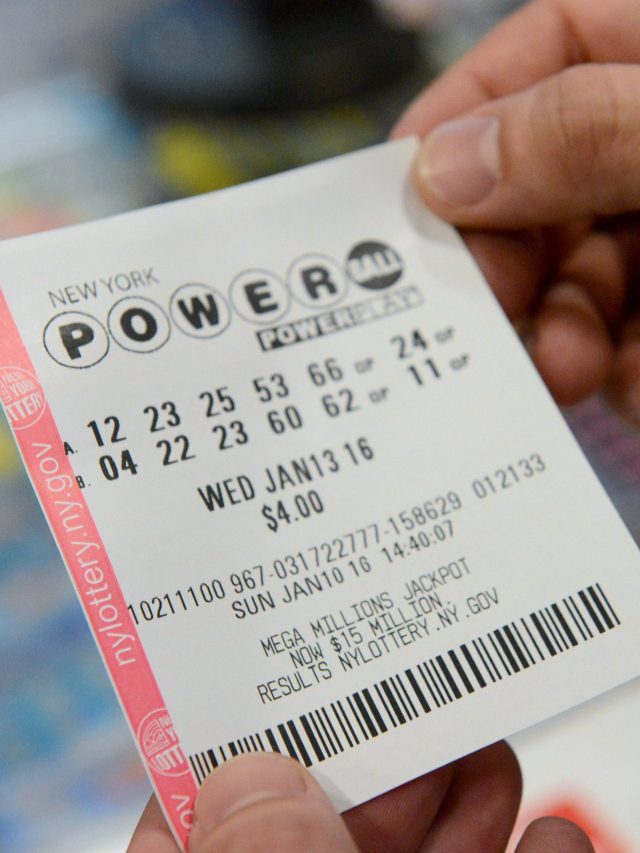 A person holds a Powerball ticket in New York